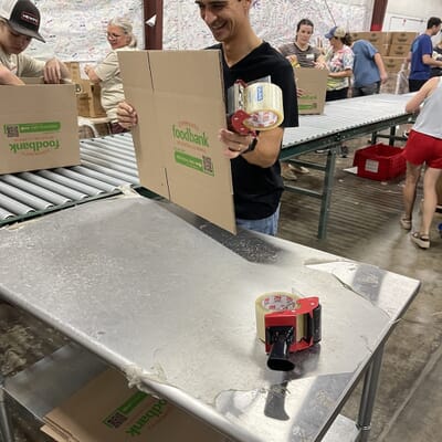 Louis volunteering with the Birmingham team at Community Food Bank of Central Alabama
