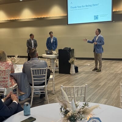 Henry, Will, and Brian presenting during a CWM Pensacola Social