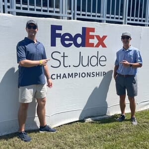 Team members Louis and Rob attend the FedEx St. Jude PGA Tour 2022 Championship