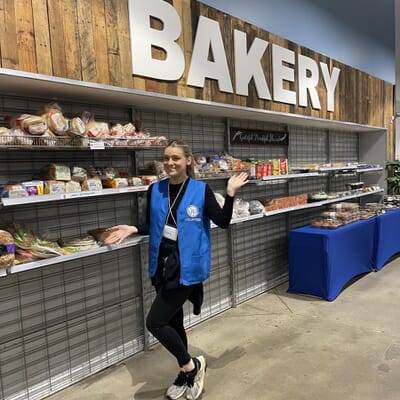 Charlotte volunteering with the Atlanta team at Society of St. Vincent de Paul Food Distribution Center
