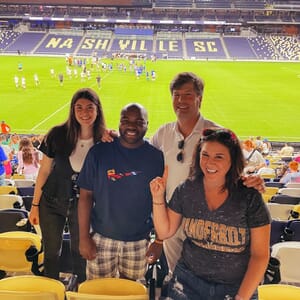 Nashville team members attend a Vanderbilt Women's Soccer game to support their summer intern