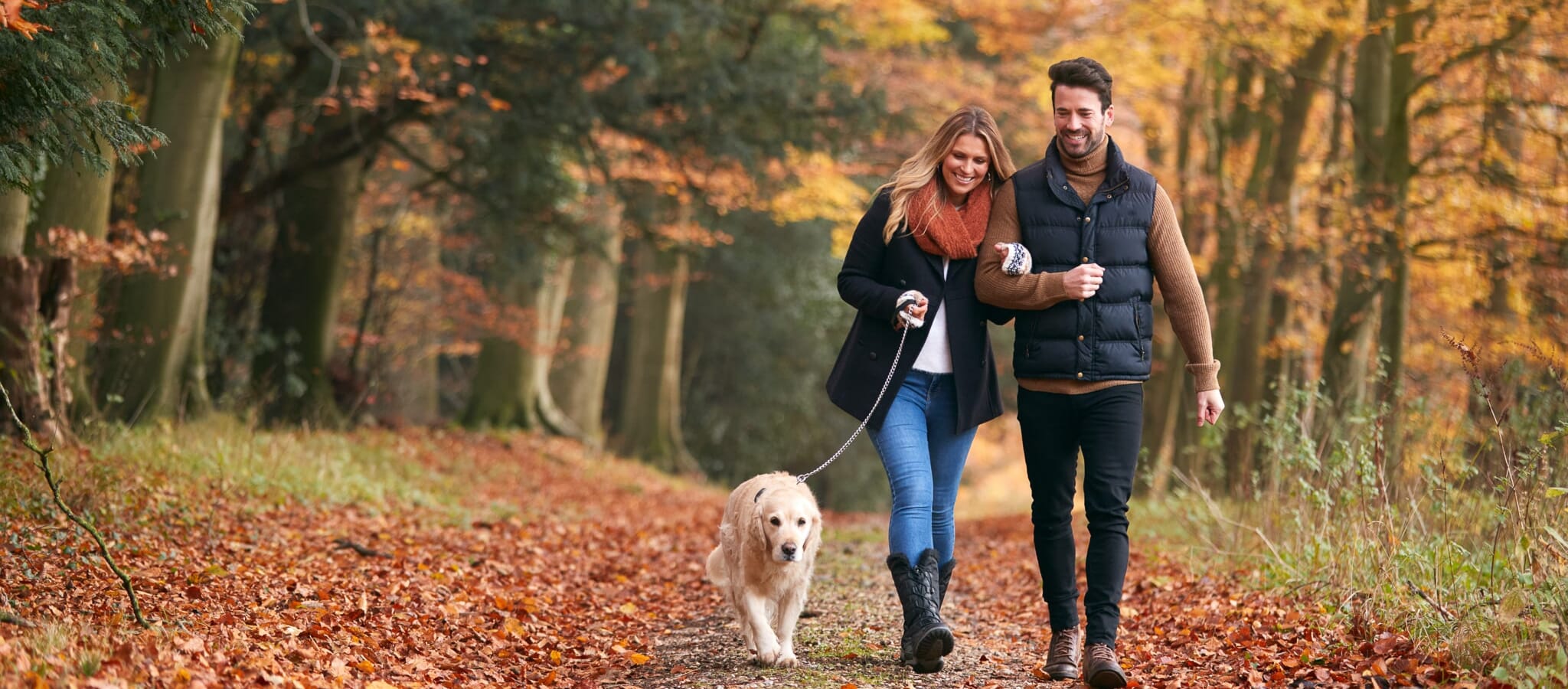 Couple walking on a wooded trail