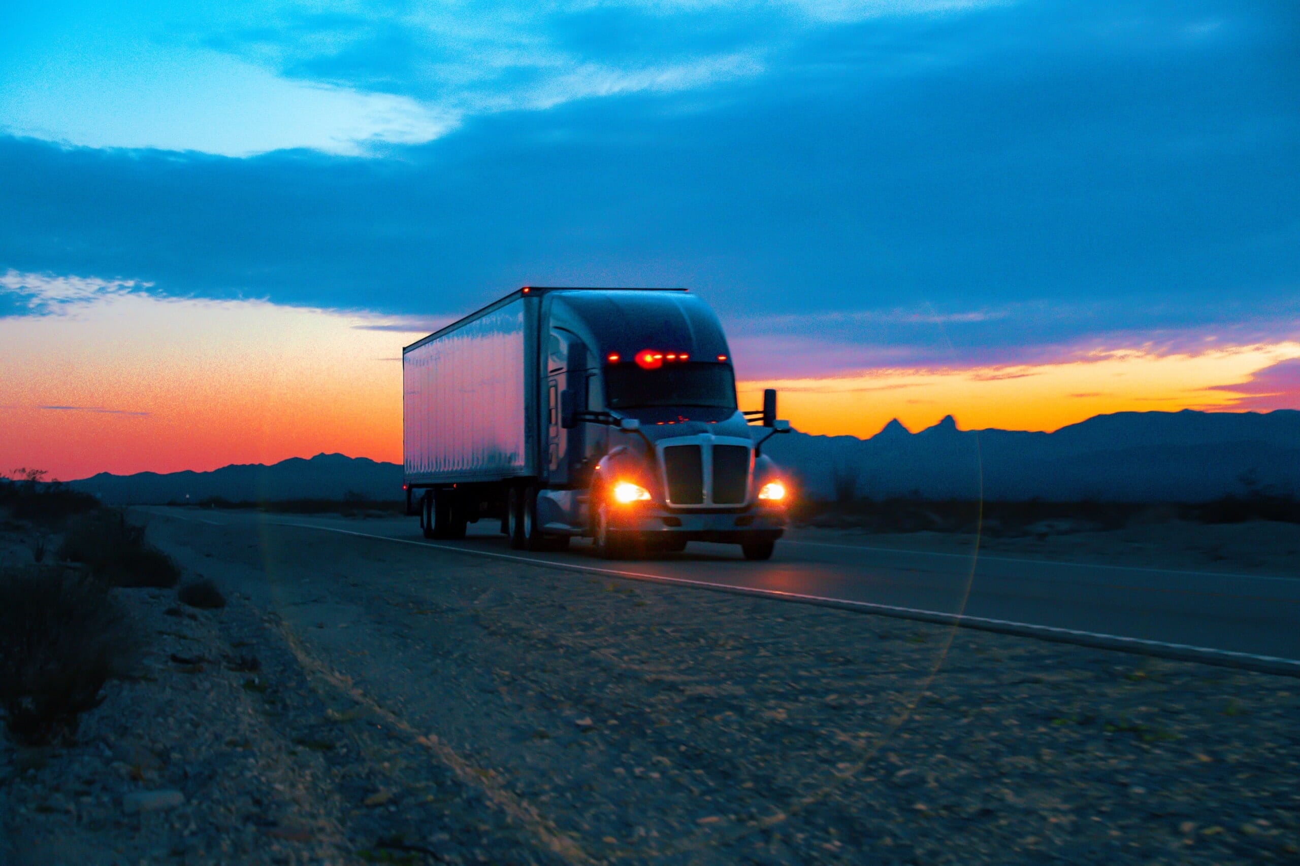 Semi truck on highway at night
