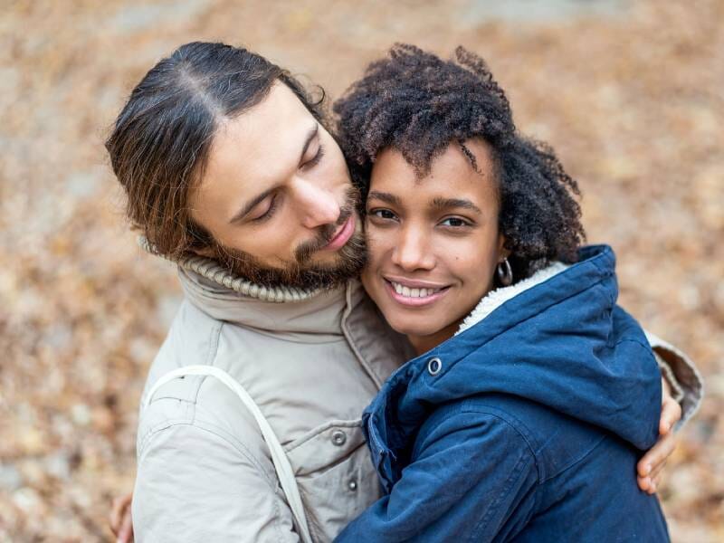 Couple embracing on a fall day