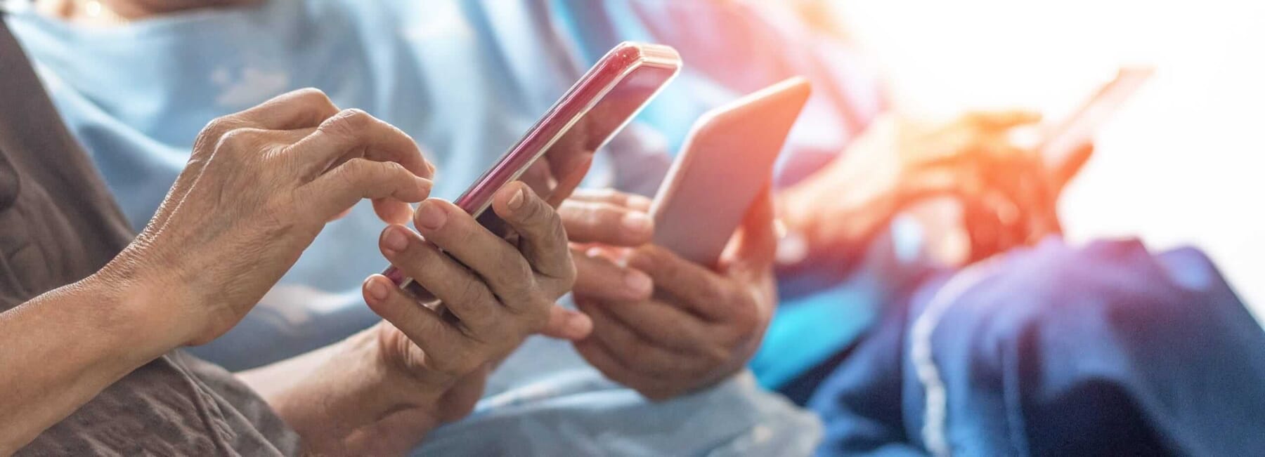 Senior citizens, sitting using mobile phones