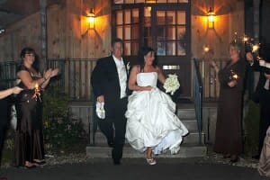 Newlywed couple leaving function hall in Maine