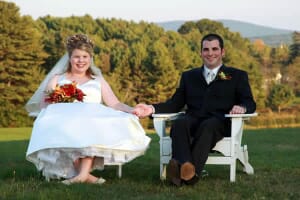 Newlywed couple in Adirondack chairs at Spring Hill
