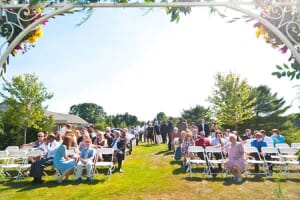 Maine wedding ceremony view of guests and trellis