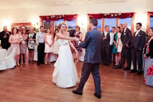 Bride and groom smiling during first dance