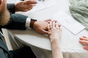 Maine wedding couple signing marriage license