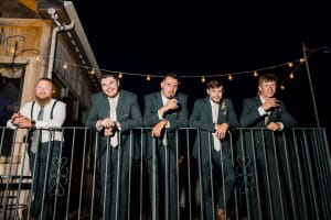 Maine wedding groomsmen on balcony