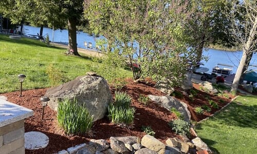 Nicely kept rock garden with fresh mulch